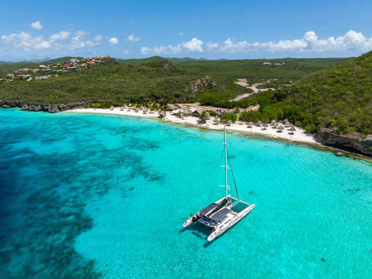 cas abou beach by boat