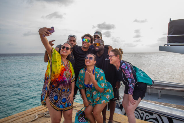 customers taking picture with the crew