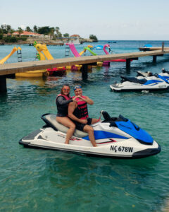 Couple on jet ski making a heart