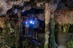 mom with kids in cave