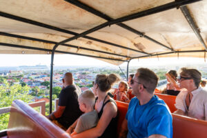 people watching the view from jeep