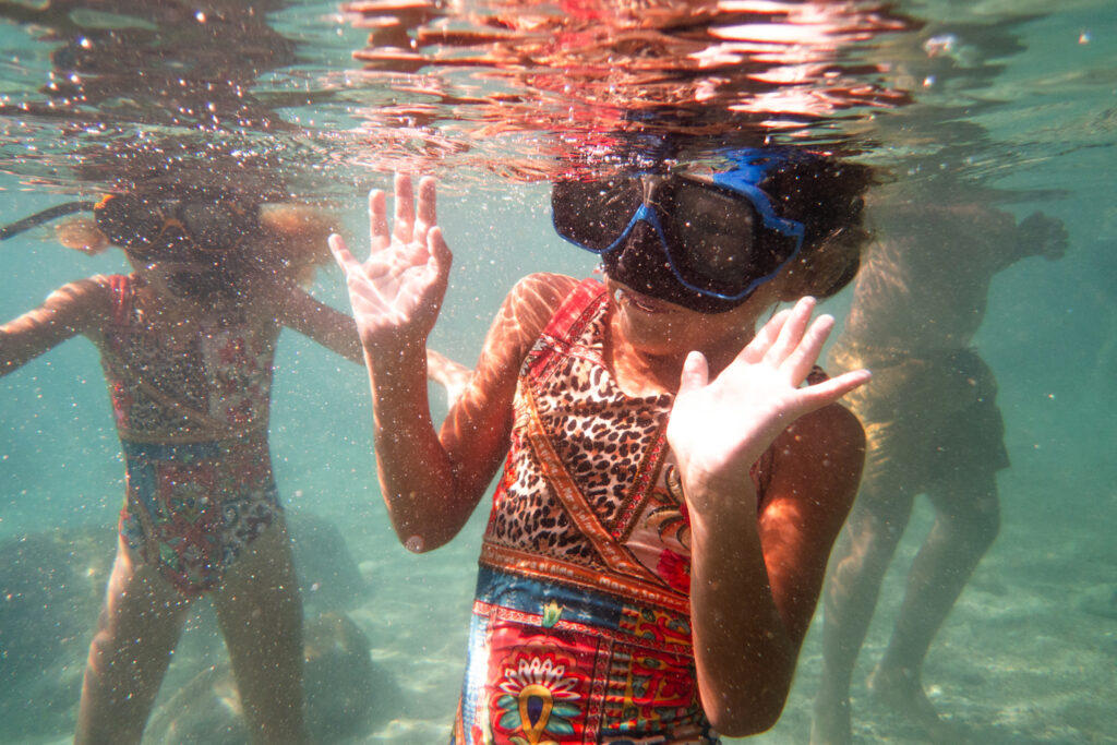 kid snorkeling at playa piskado